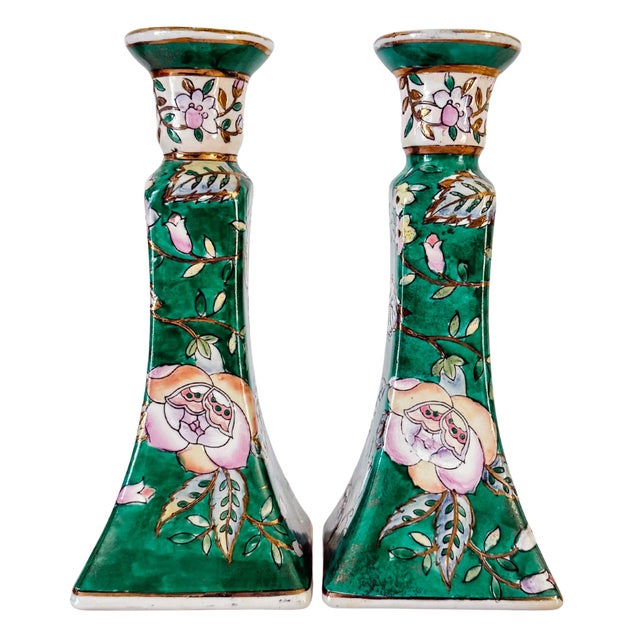 Add a striking splash of color to your tabletop or mantel with this vintage pair of Chinese Famille Verte porcelain...