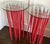 A pair of tall red ORG table designed by Fabio Novembre (Italian, born 1967) in 2001 for Cappellini. Made of glass top...