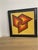 Striking geometric piece in vivid warm colors framed and matted in black. Signature is illegible. Numbered 184/250.