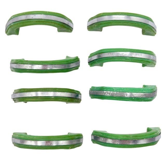 Set of 8 light forest green bakelite drawer/door pull knobs each with a chrome strip down the center. Complete your period...