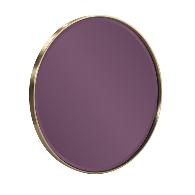 The fun and unique design, coupled with the vibrant purple face, adds a pop of color and reflective charm to your space....