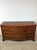 This mid century Georgian style lowboy dresser features hardwood construction, mahogany veneer with original finish, nine...