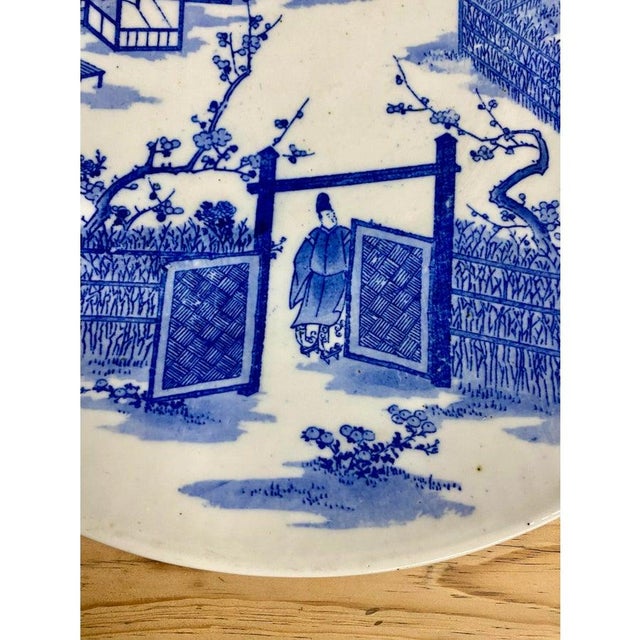 Late 19th Century Antique Japanese Blue and White Porcelain Charger Plate With Pictorial Spring Scene For Sale - Image 5 of 7