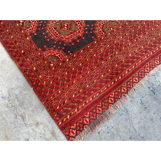 The Afghan Turkoman rug is hand-knotted and 100% wool, This Afghan Turkoman rug will enhance your home's style. This rug...
