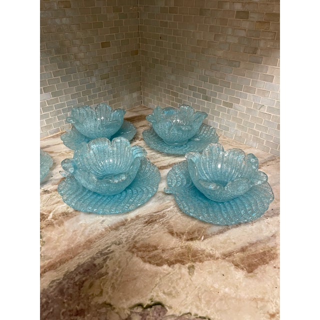 Beautiful Fratello Toso "overshot" blue glass bowls with underplates. Overshot is a technique originating in Murano, Italy...