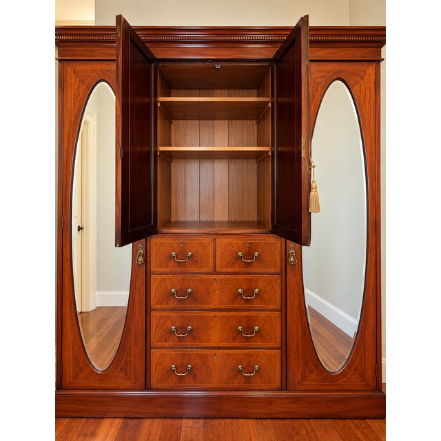An impressive English Edwardian triple armoire crafted from richly figured mahogany and dating to circa 1900. Beautifully...