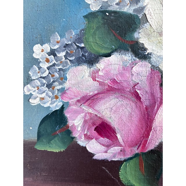 A vintage original oil painting of a floral still life, dating from around 1960. The painting shows a richly colored...