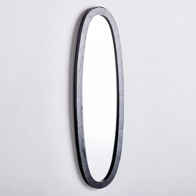 At nearly 40 inches high, this mirror is made for the open concept space. In a textured matte black finish, it adds a...