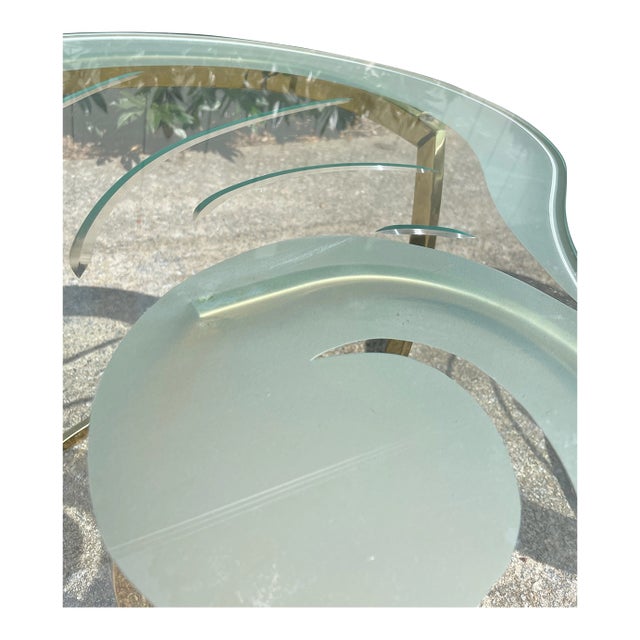 Pair of vintage etched glass & brass kidney shaped side tables. Thick glass on sturdy frame.