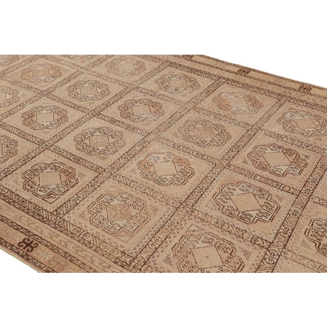 Hand knotted in wool originating from East Turkestan circa 1890-1900, this antique rug is among the spacious acquisitions...