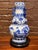 Up for listing is a striking 15-inch Chinese blue and white porcelain double gourd vase featuring dual molded dragon-form...