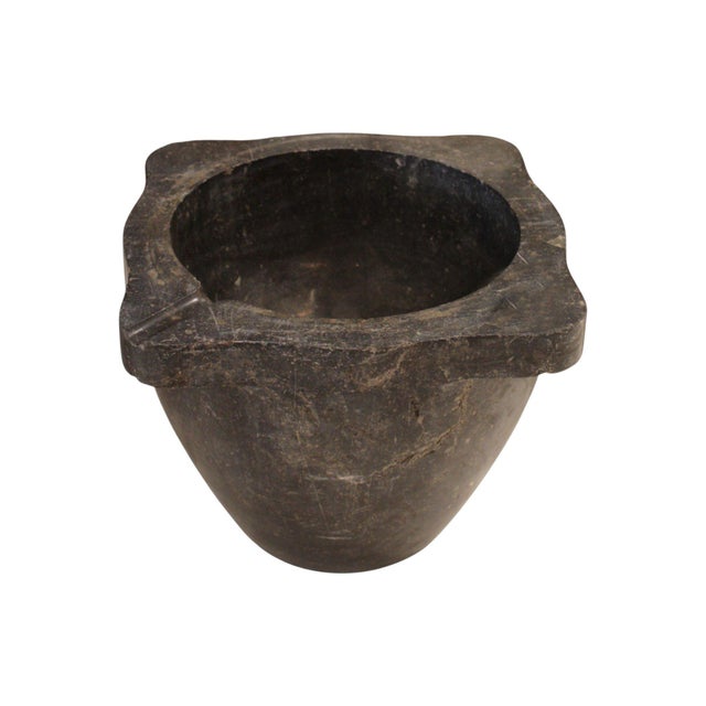 This 19th-century French antique black stone mortar bowl is carved from solid stone with a smooth, time-worn surface. The...