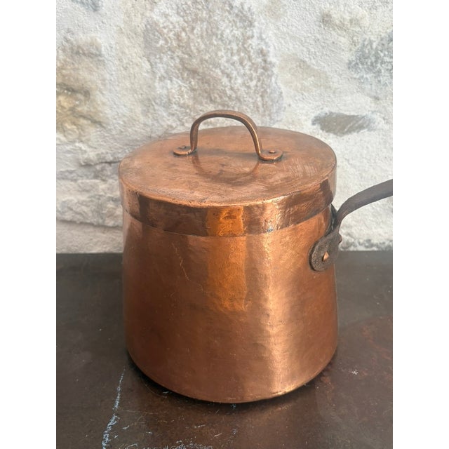 Circa 1840 French copper daubiere with a dovetailed body seam. Includes original lid with riveted copper loop handle, and...