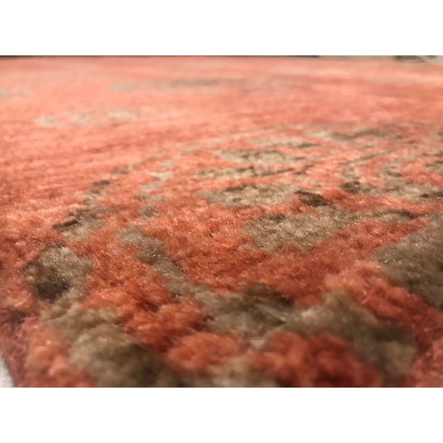 This vintage piece was hand-crafted in India during the 1960s. It is made of wool on cotton foundations.