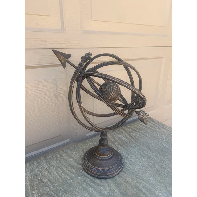 A beautifully crafted iron armillary sphere, evoking the timeless elegance of classical European gardens. Pieces like this...