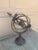 A beautifully crafted iron armillary sphere, evoking the timeless elegance of classical European gardens. Pieces like this...
