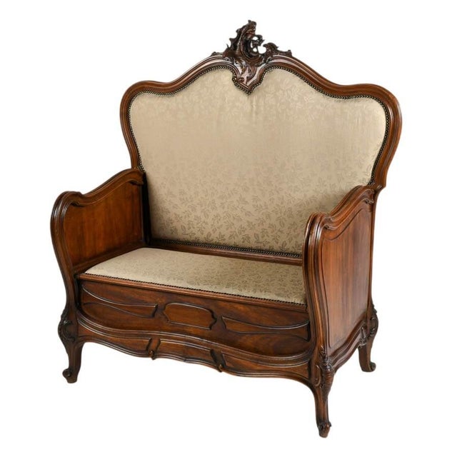 This antique Rococo hall bench is a striking decorative seating piece that combines sculptural form with practical...