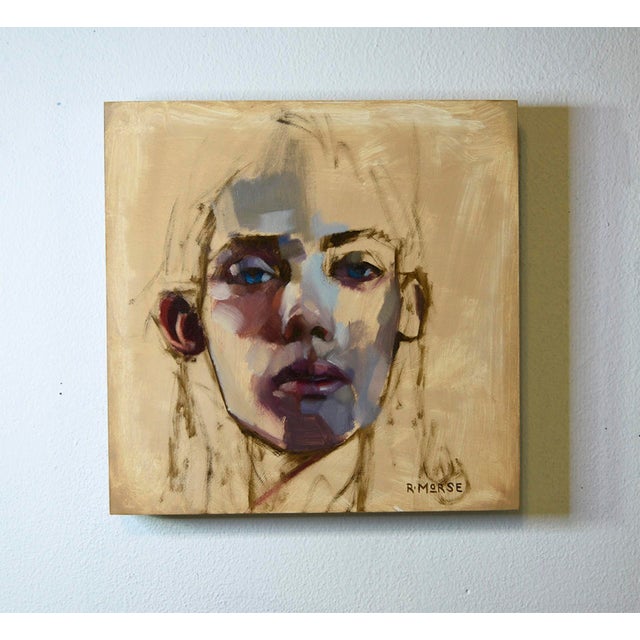 Piercing Blues features a striking portrait characterized by a blend of soft and bold brushstrokes that convey depth and...