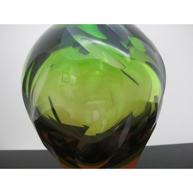 German WMF mid century modern art glass vase in green with yellow to amber tone underlay. Oval textured thumbprint design....