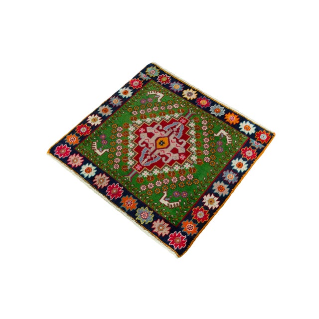 This small, artfully hand-knotted Shiraz rug comes from the Shiraz region and reflects the rich symbolism and color...