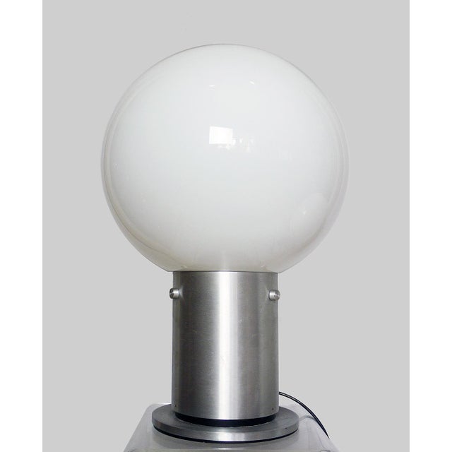 Original space age sputnik table light with a aluminum stand and a milky-white glass globe. Made by Glashütte Limburg,...
