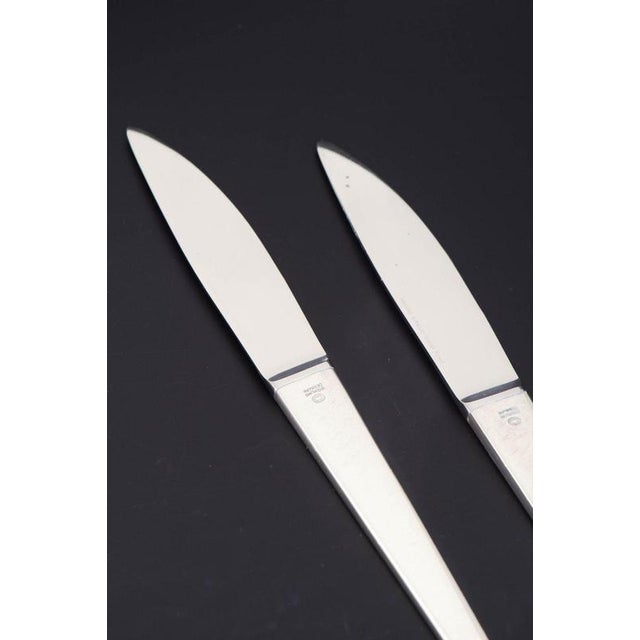 Henning Koppel for Georg Jensen, two small lunch knives Caravel. Two lunch knives in stainless steel and sterling silver...