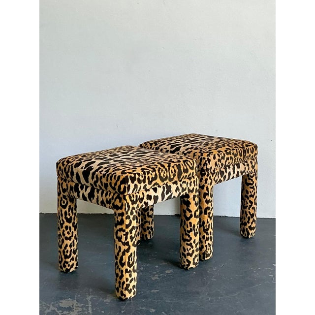 This striking pair of vintage stools embodies the bold, glamorous spirit of Hollywood Regency design. Fully upholstered in...