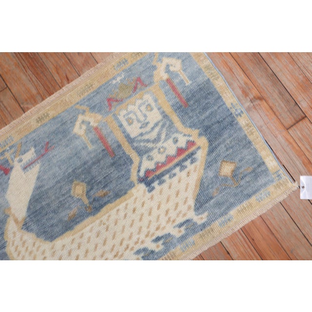 Unusual facial figure and snake slayer 3rd quarter of the 20th Century Turkish Pictorial Rug Measures: 1'9'' x 2'7''.