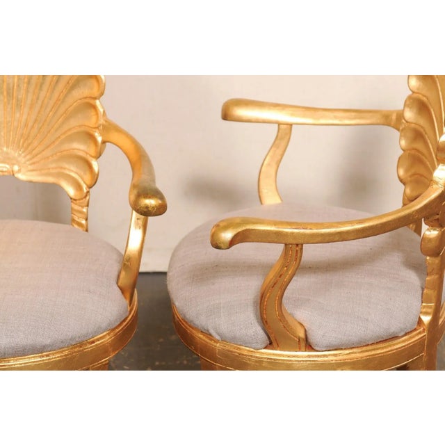 An Italian pair of gold tone grotto style armchairs with upholstered seats, from the mid/later part of the 20th century....