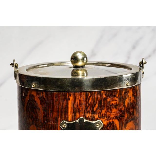 A handsome example of Edwardian-era English tableware, this antique biscuit barrel dates to circa 1915 and beautifully...