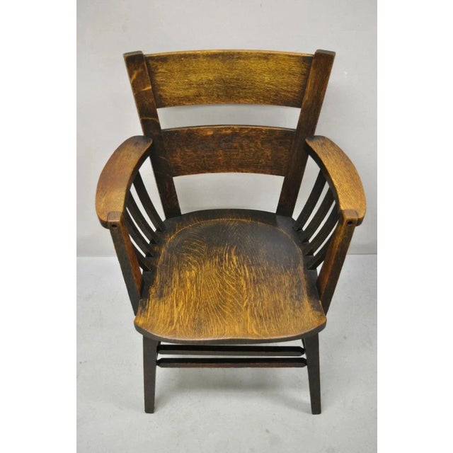Arts & Crafts Early 20th Century Antique Arts & Crafts Mission Oak Bowed Spindle Plank Seat School Arm Chair For Sale - Image 3 of 12