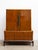 A mid century tallboy chest of drawers by Genova Furniture Company. A warm lacquered walnut finish, burl wood accents,...