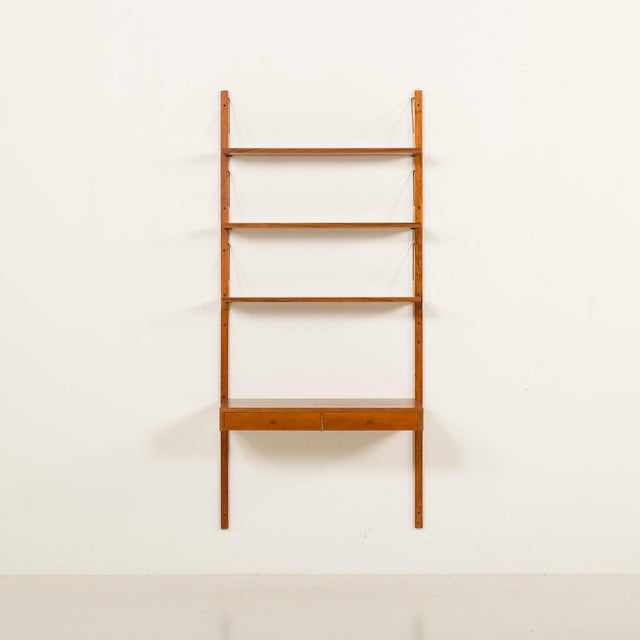 The teak shelving unit with a desk was made in denmark, some time in 1960s. It is a great alternative to regular desks...