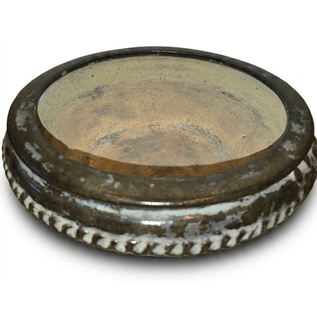 This Song-style brown-glazed stoneware bowl features an earthy aesthetic inspired by historic Chinese ceramics.
