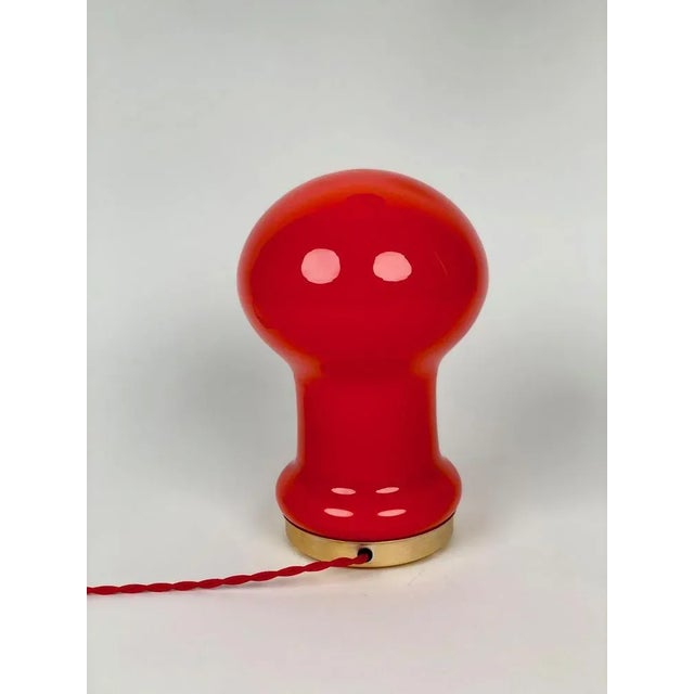 A beautiful red orange, opaline glass table lamp produced by opp jihiava and designed by stepan tabery in the 1970's in...