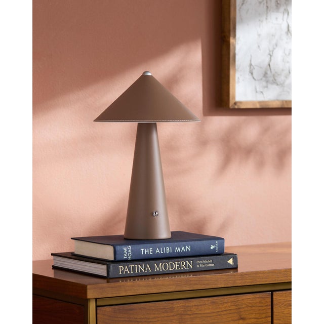 Illuminate your space with a touch of retro flair with the Nomelle accent table lamp. Standing at a charming 12 inches...