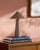 Illuminate your space with a touch of retro flair with the Nomelle accent table lamp. Standing at a charming 12 inches...