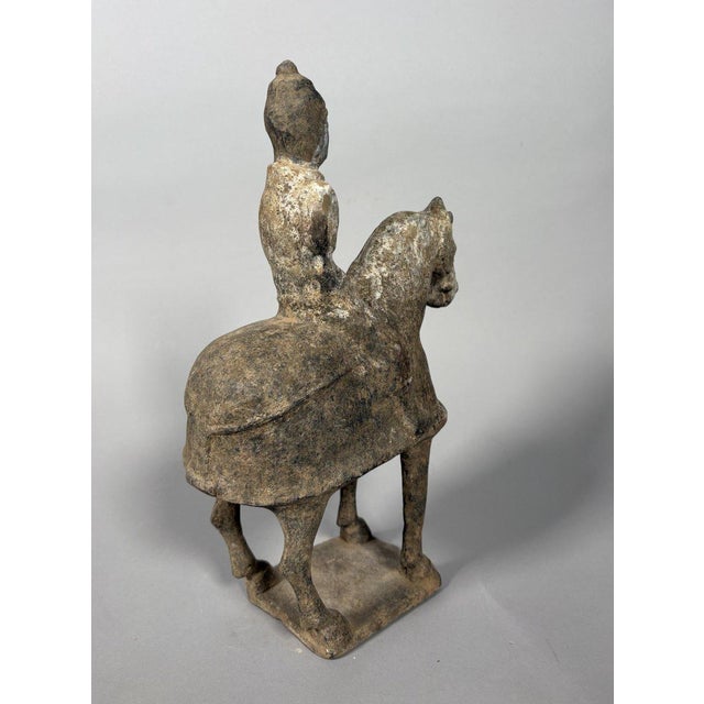 Sculpture of a Mingqi Horseman, China, Tang Dynasty (618-907). Terracotta sculpture painted with a white and gray slip....