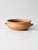 A charming antique terra cotta bowl with a low, rounded form, softly rolled rim, and two petite loop handles. Crafted from...
