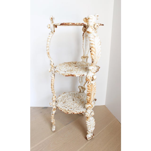 19th Century French Tiered Cast Iron Plant Stand with Leaf Relief. Want to explore more products at Antiquelifestyle. To...