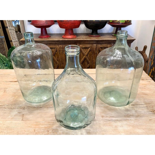 Vintage hand blown glass jug. Each handmade and unique. Measurements are approximate. Each sold individually.