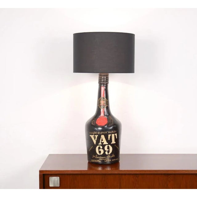 This wonderful VAT 69 old store display bottle has been converted into a lamp. It’s great to create a special effect in...