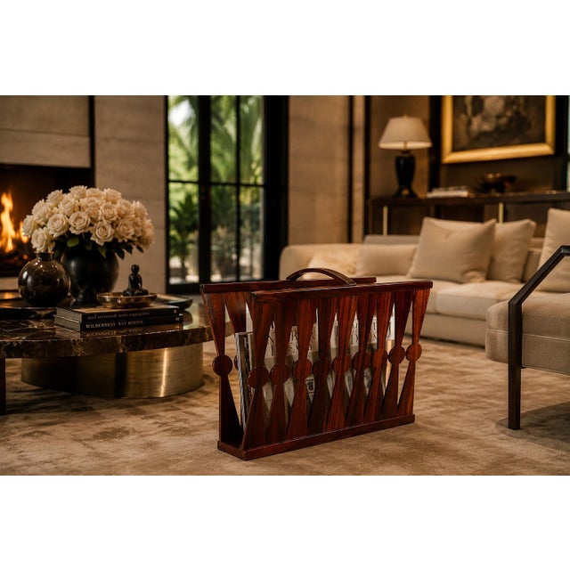 A striking Brazilian modern magazine rack crafted entirely in richly figured rosewood, distinguished by its sculptural...