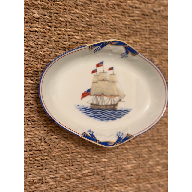 This is a Mot­tahedeh “Our Maritime Heritage” porcelain dish, featuring the U.S. Frigate Constitution—better known as “Old...