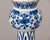 This Dutch Delft vase follows the classic garlic neck form, its bulbous body rising through a slender fluted neck to a...
