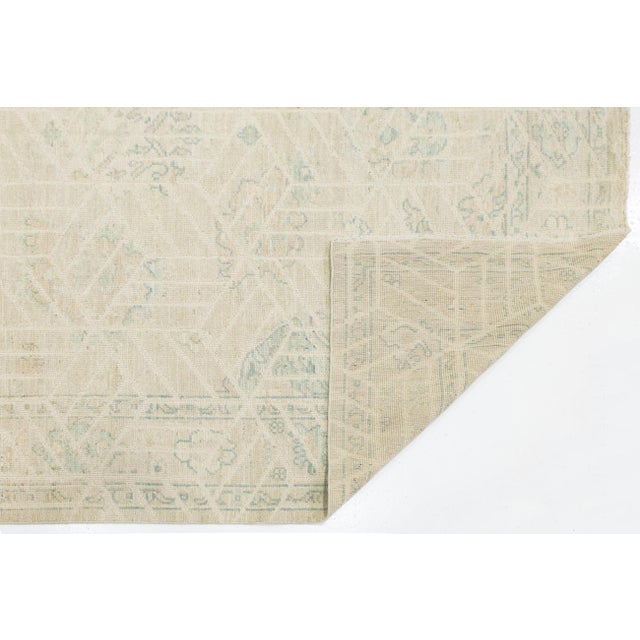 Elevate your space with this Modern Oushak style area rug. Hand-knotted from premium wool, it features a soft, low-pile...