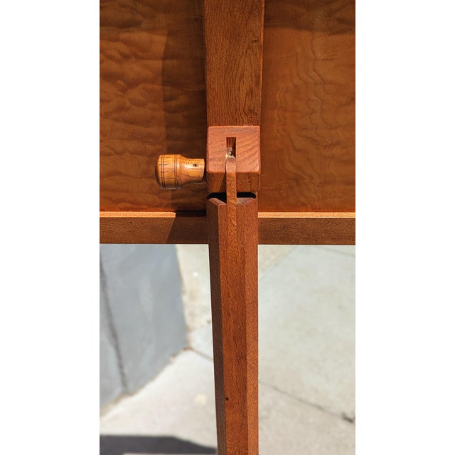 A sculptural and sophisticated 1940s burlwood podium or music stand, showcasing the rich visual texture of burlwood veneer...