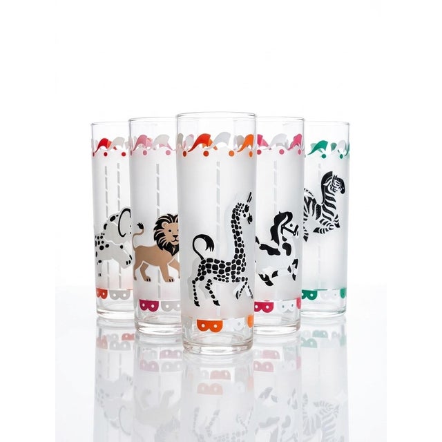 These vintage Hazel Atlas tumblers feature whimsical, frosted-glass carousel animals finished with festive, multi-colored...