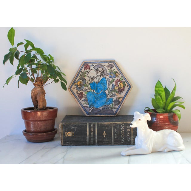 Antique hexagonal Persian Iznik Qajar style ceramic pottery tile with woman surrounded by flowers. No makers mark. Age...