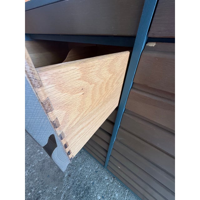 This Sligh 10-drawer dresser features a refinished dark teal frame paired with wood-grained, horizontal-slatted drawers....